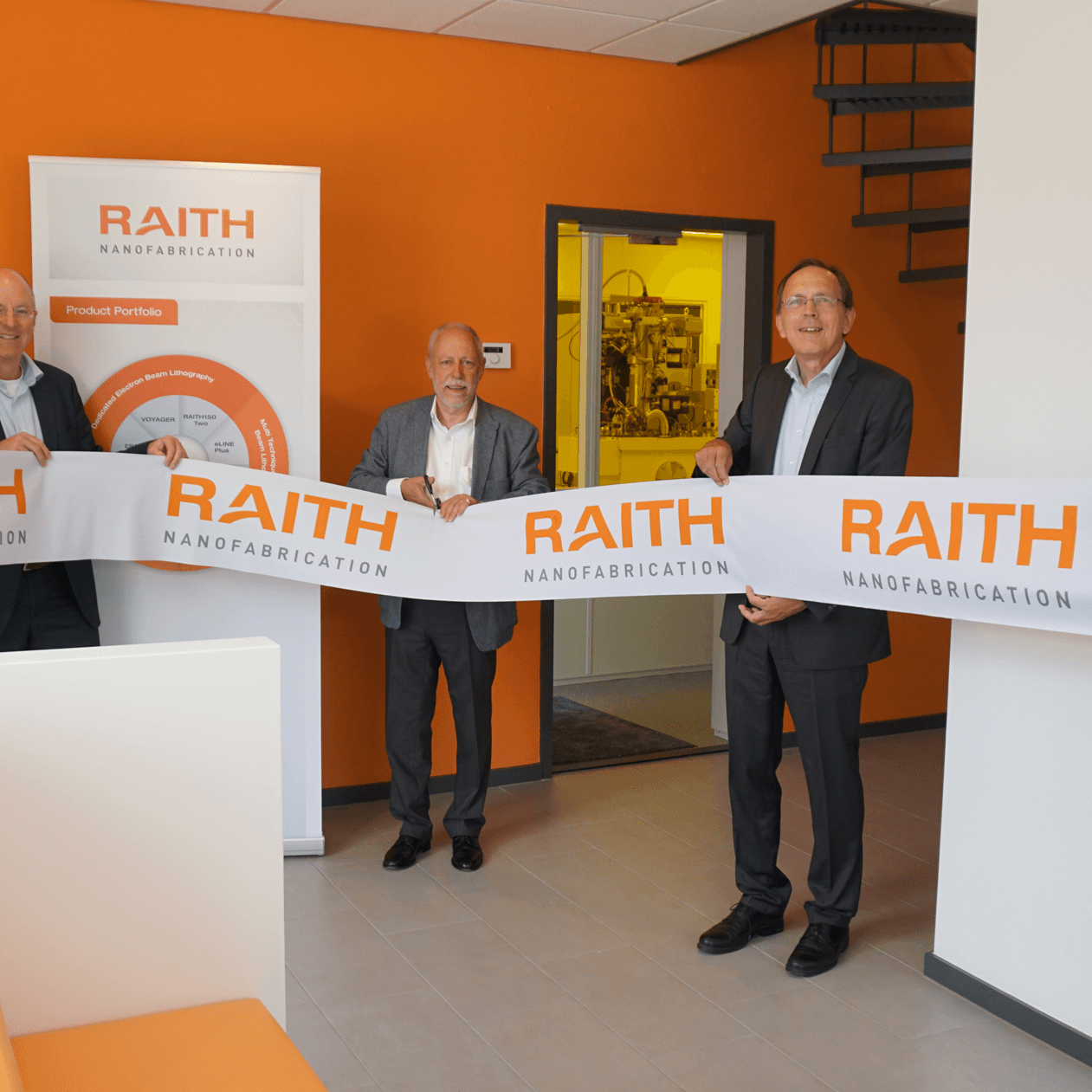 Photo of parts of the Raith managment at demo center opening